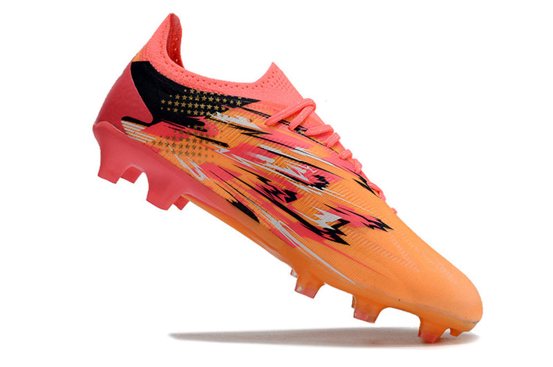 Chuteira Campo Puma Ultra Ultimate FG Laranja e Rosa "Pulisic"